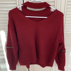 Burgundy sweater with cute neck detail.